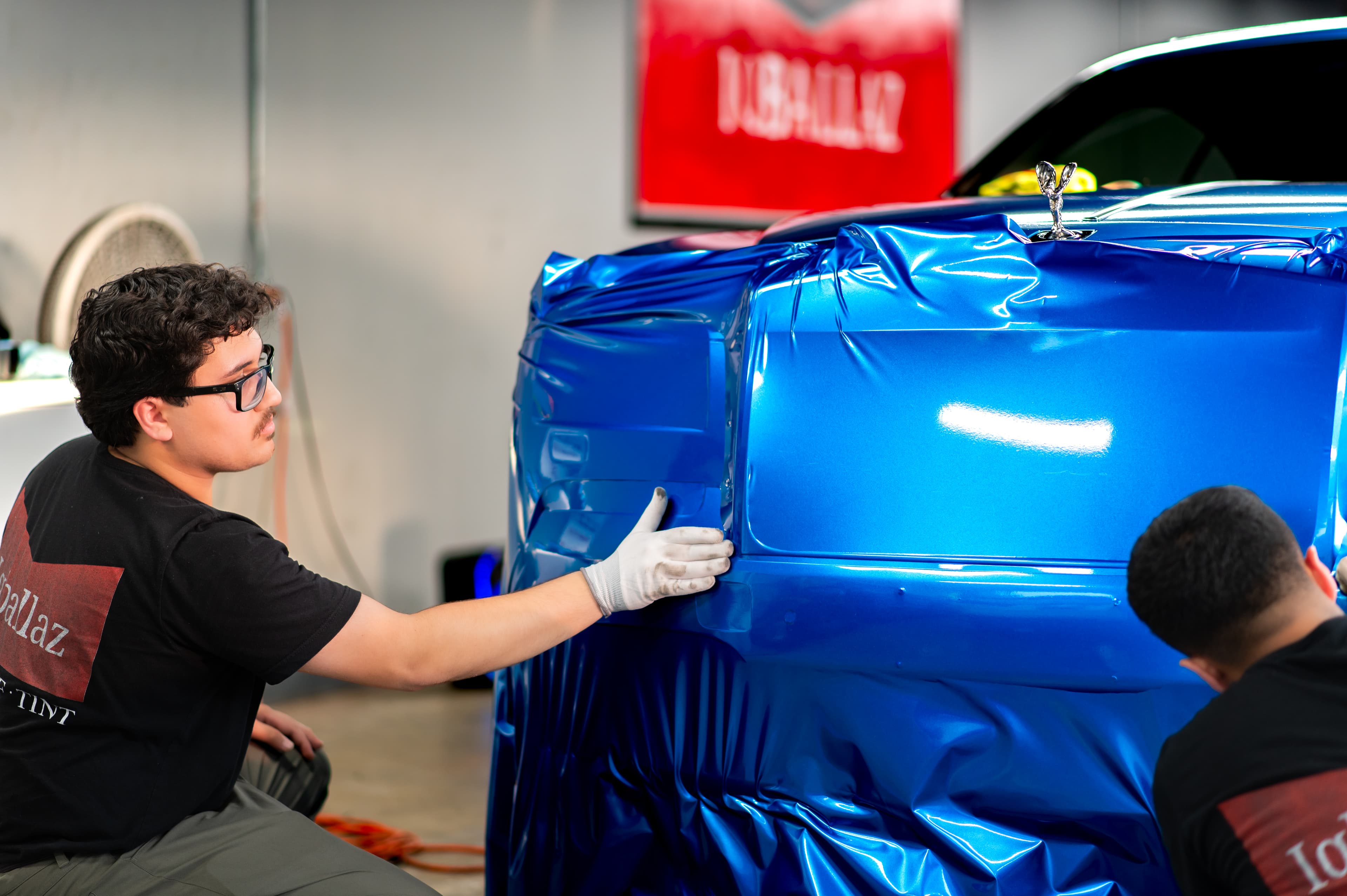 Tesla Cybertruck in satin black wrap under studio light